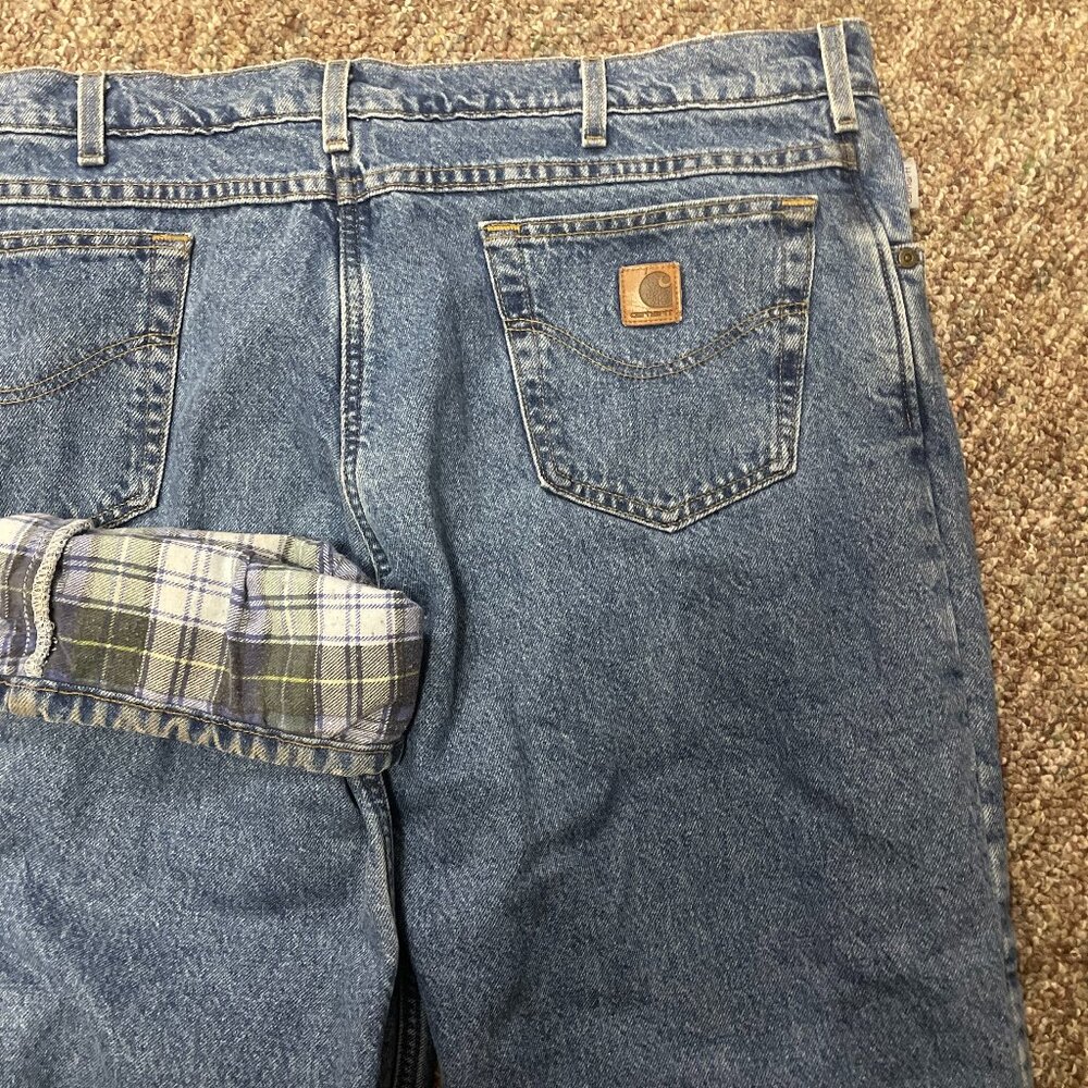Vintage Carhartt flannel-lined denim jeans made in the USA, dated 1985.